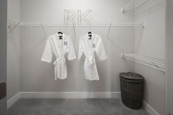 Walk-in closet with wire shelving and dual robes